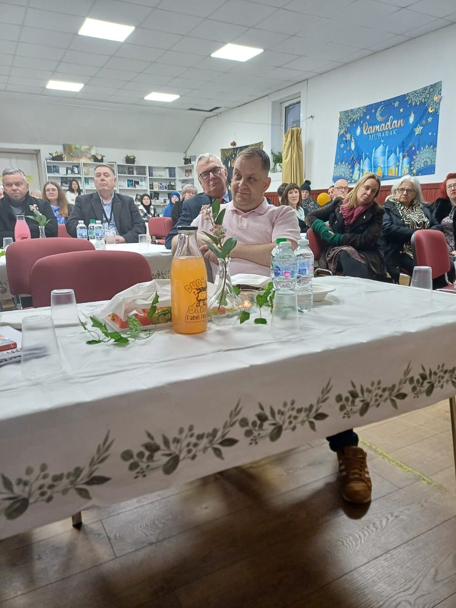 Community members sharing an iftar meal hosted by NLMWA